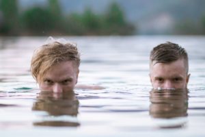 two guys swimming